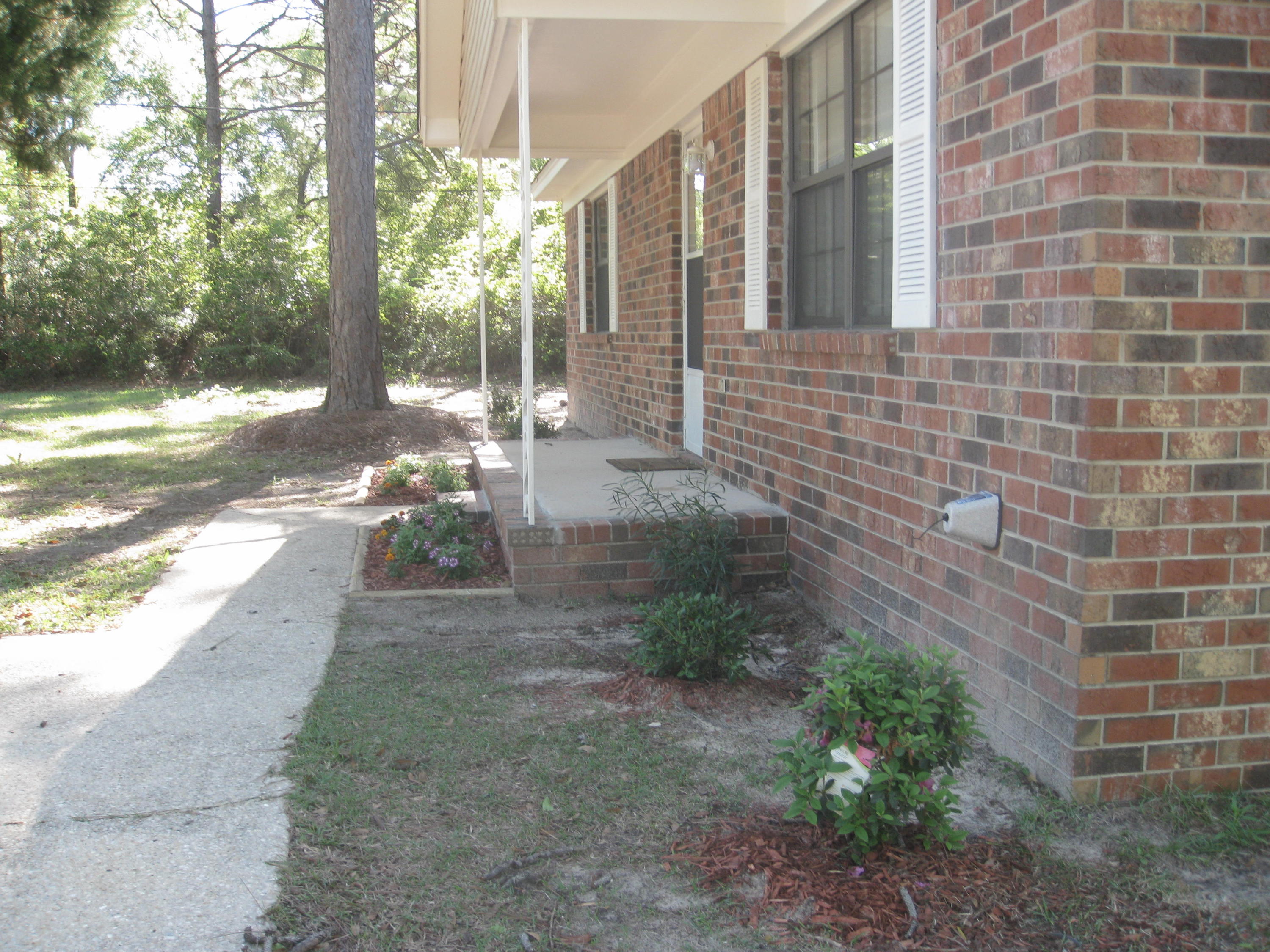 3310 Auburn Road Crestview, FL 32539 - Photo 6 of 44 a view of a pathway with a yard