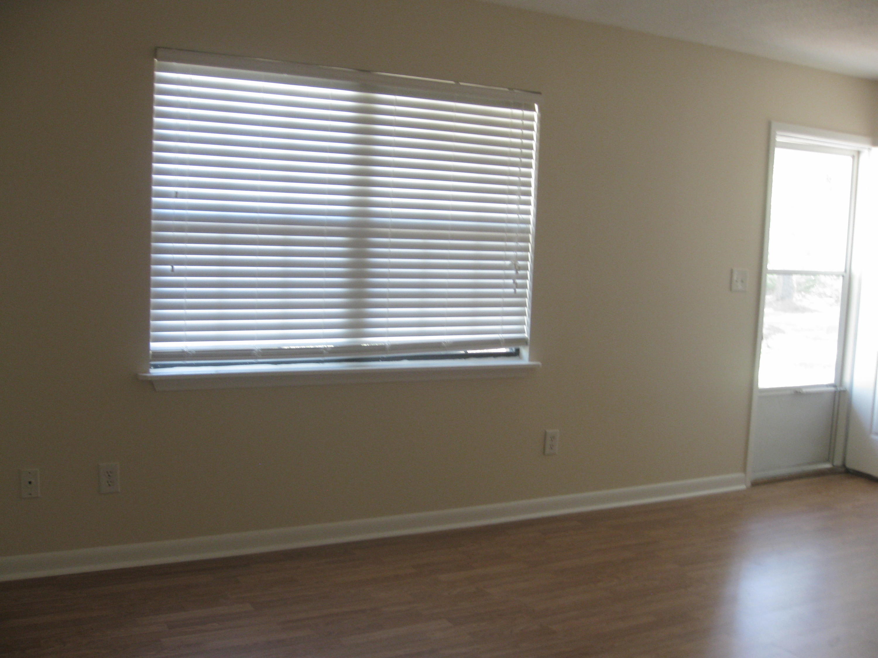 3310 Auburn Road Crestview, FL 32539 - Photo 8 of 44 an empty room with wooden floor