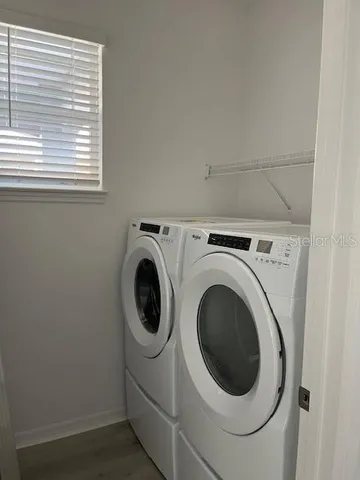 a utility room with dryer and washer