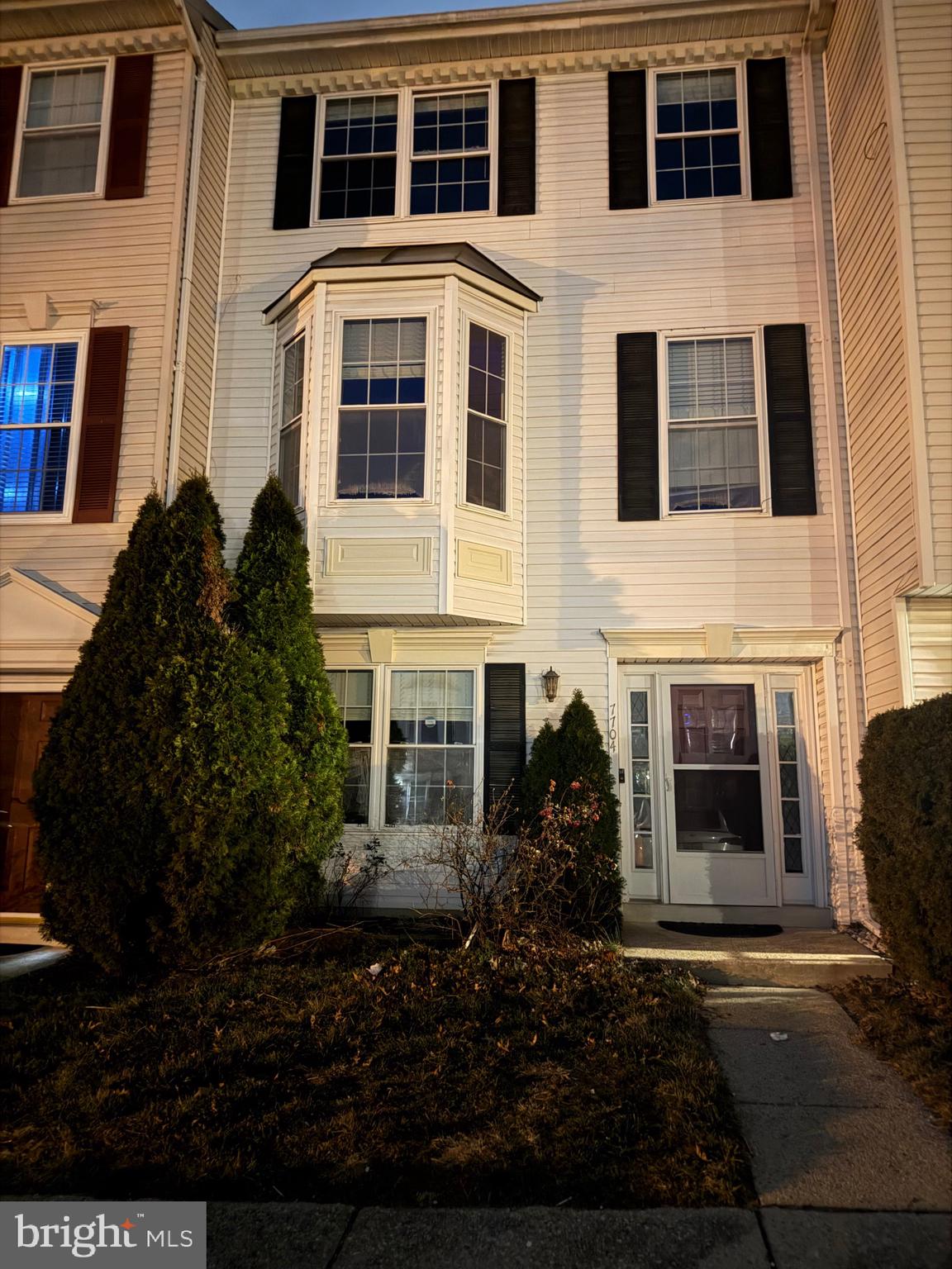 7704 Periwinkle Way Severn, MD 21144 - Photo 18 of 18 a large building with outdoor space