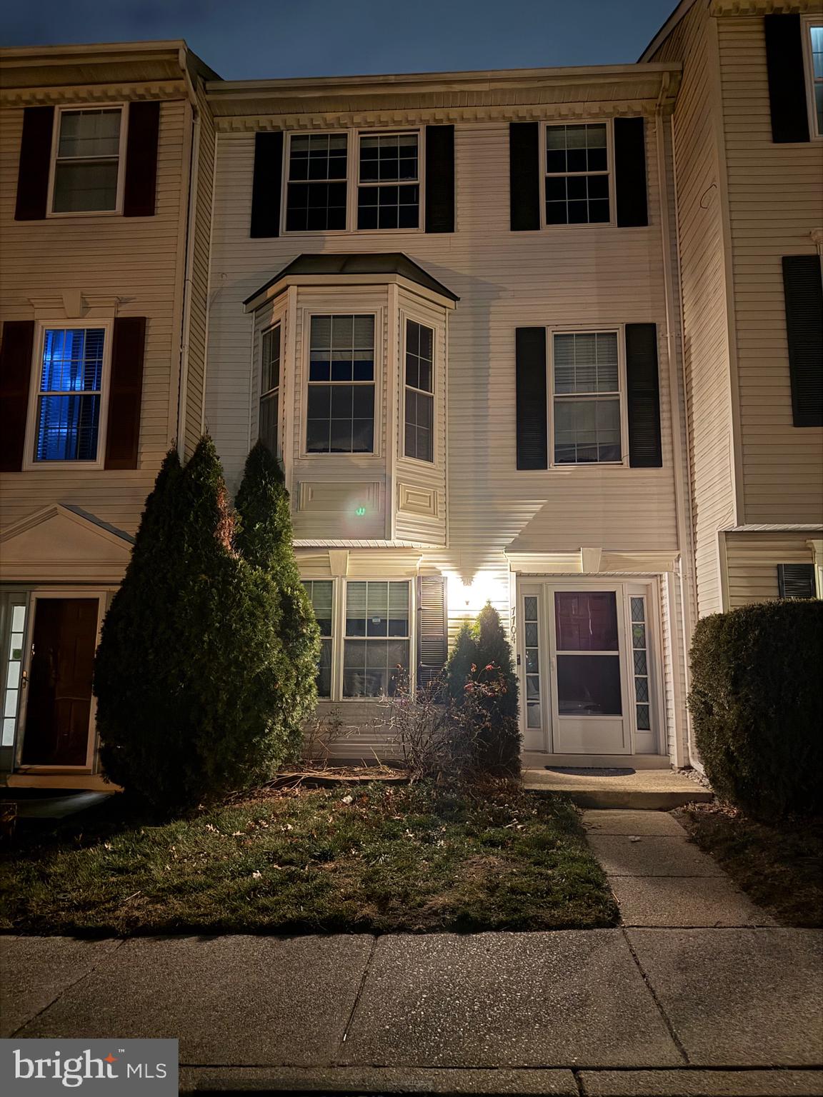 7704 Periwinkle Way Severn, MD 21144 - Photo 6 of 18 a large brick building with many windows