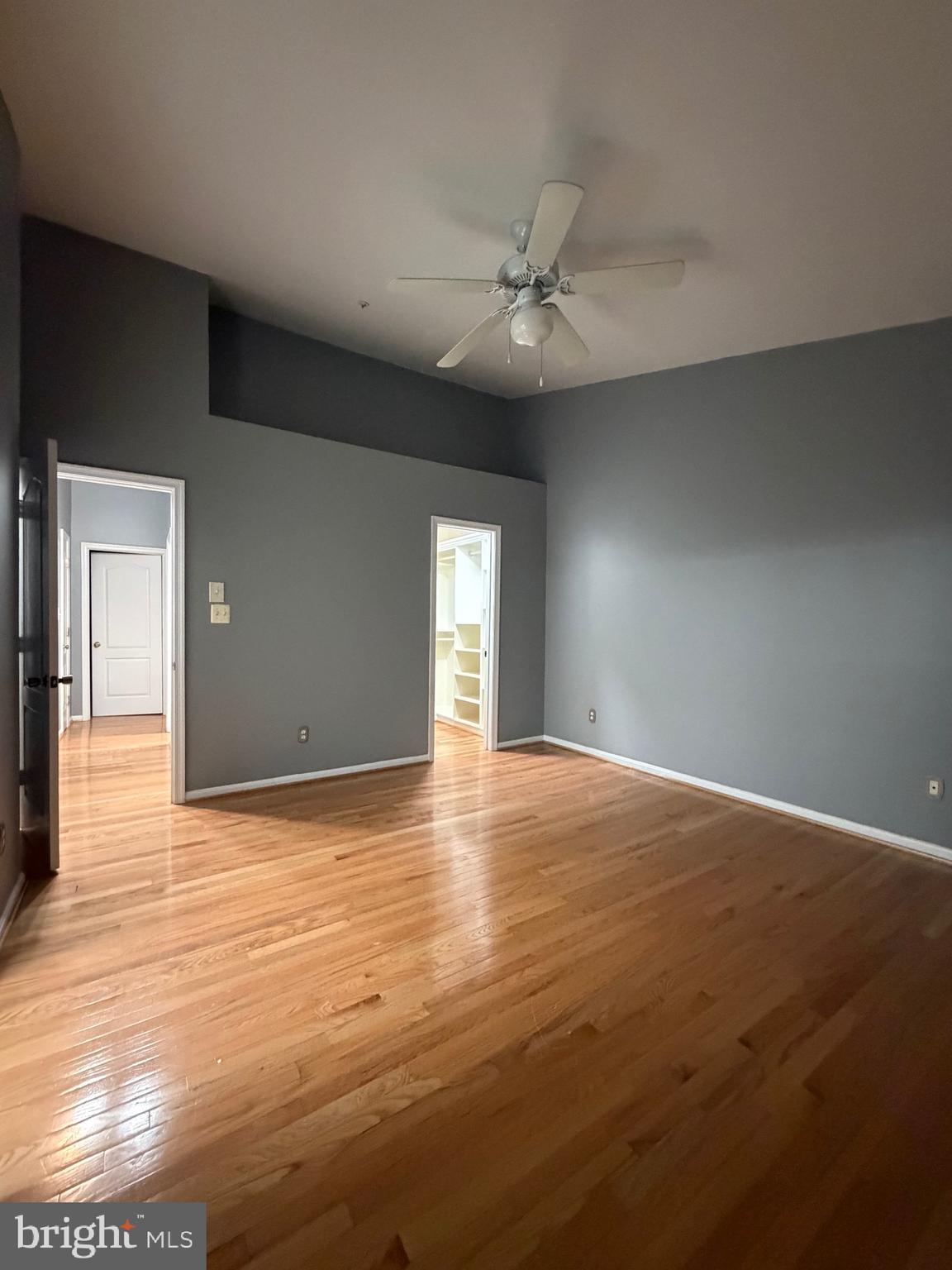 7704 Periwinkle Way Severn, MD 21144 - Photo 7 of 18 a view of empty room with wooden floor and fan