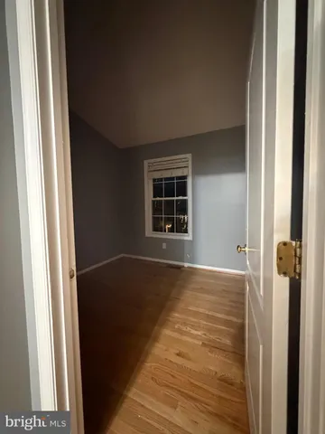 a view of an empty room with windows