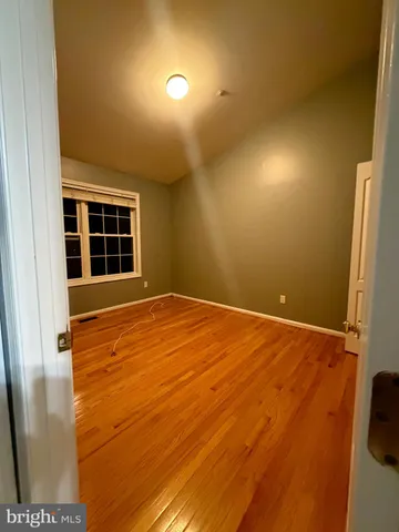 a bathroom with a sink a toilet a mirror and shower