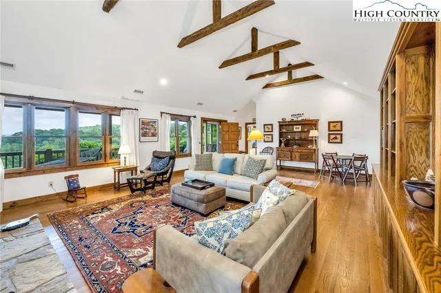 a living room with furniture or couch and a wooden floor