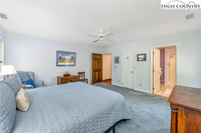 a bedroom with a bed and cabinets