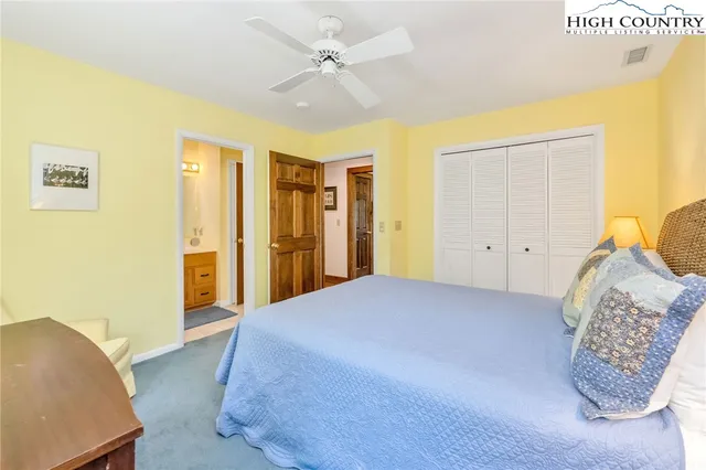 a bedroom with a bed and a walk in closet