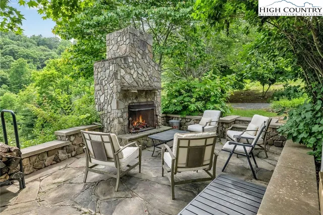 a view of a patio with a table and chairs
