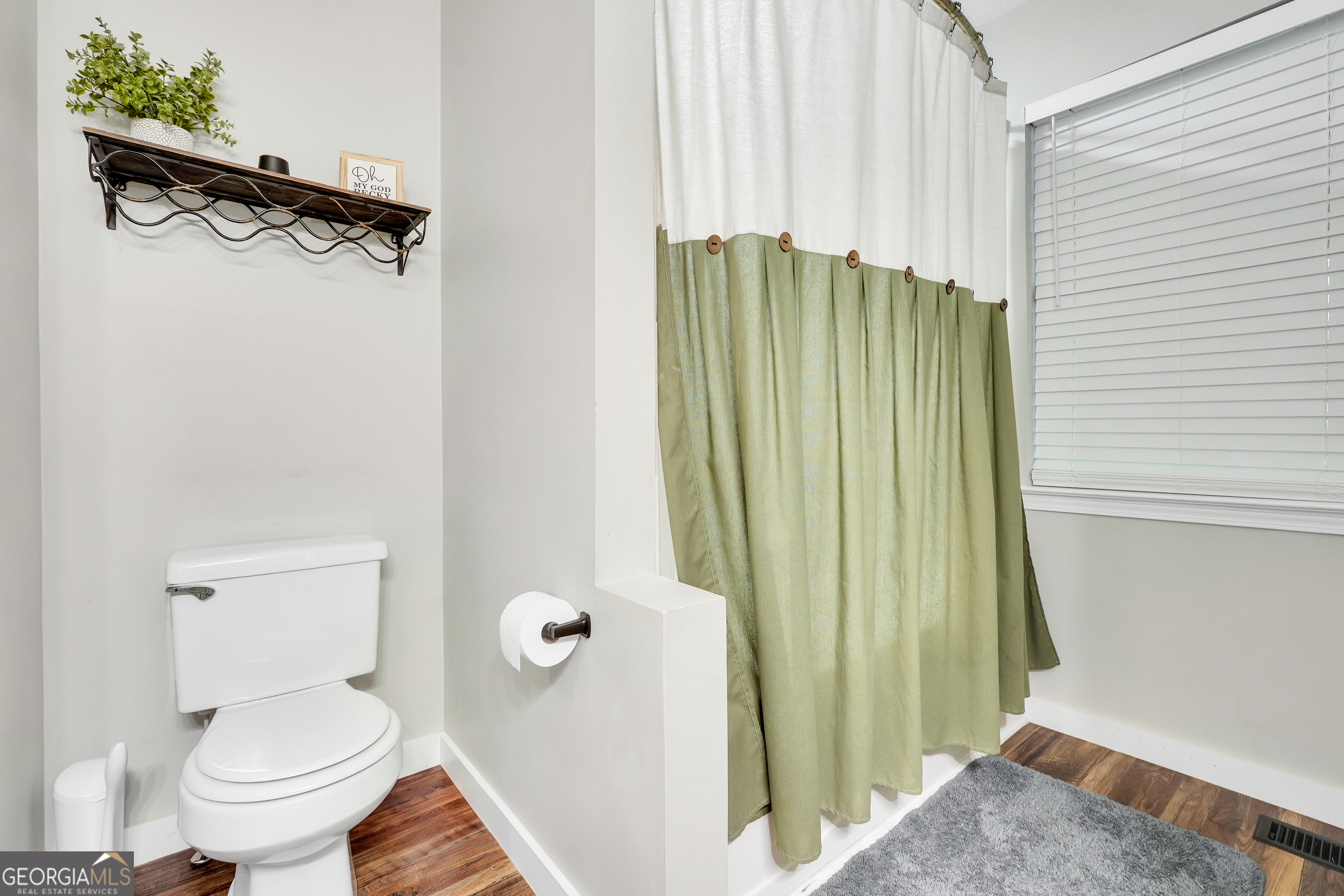 533 Chuli Road Griffin, GA 30223 - Photo 14 of 53 a bathroom with a toilet and a shower