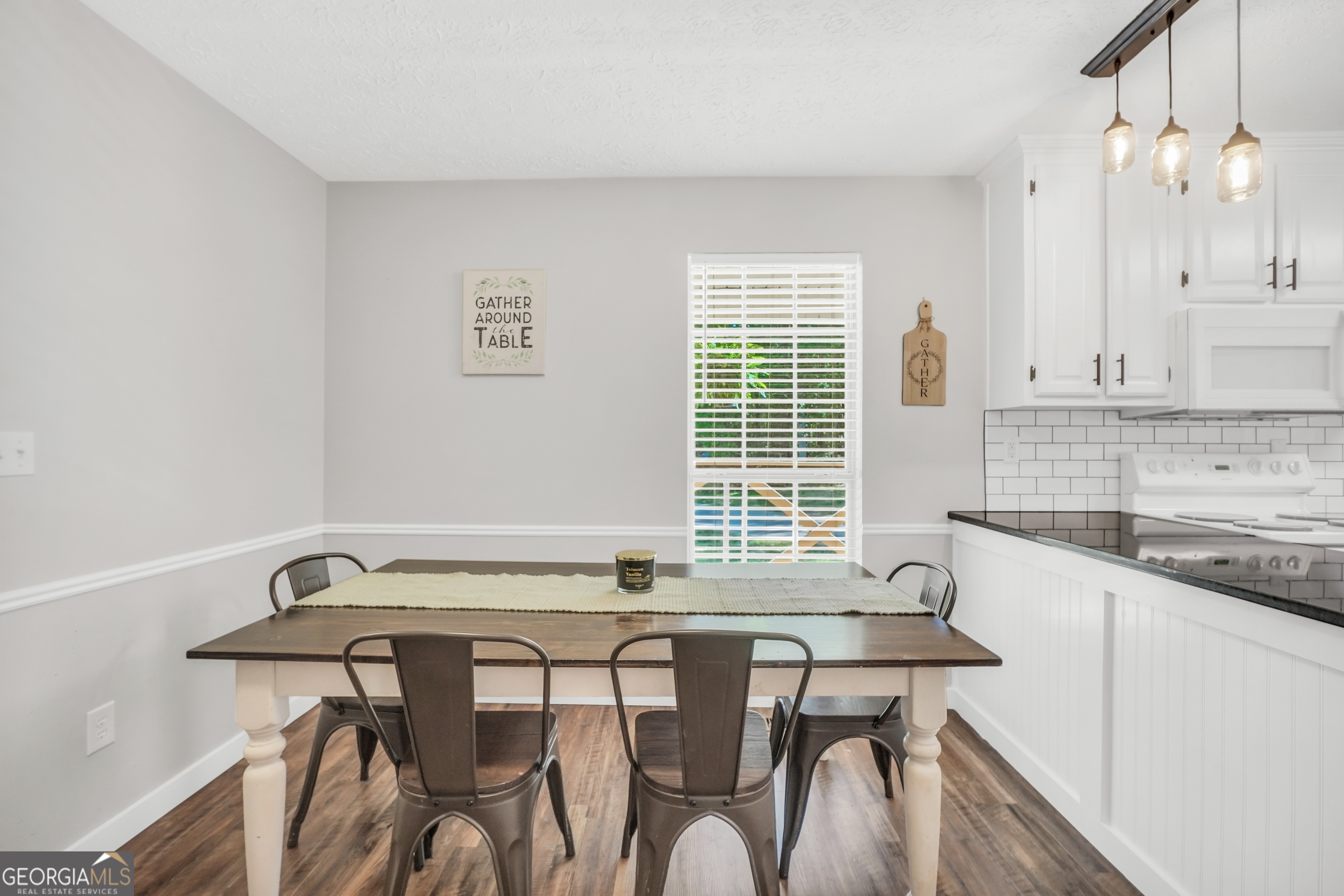 533 Chuli Road Griffin, GA 30223 - Photo 26 of 53 a room with a table chairs and a window