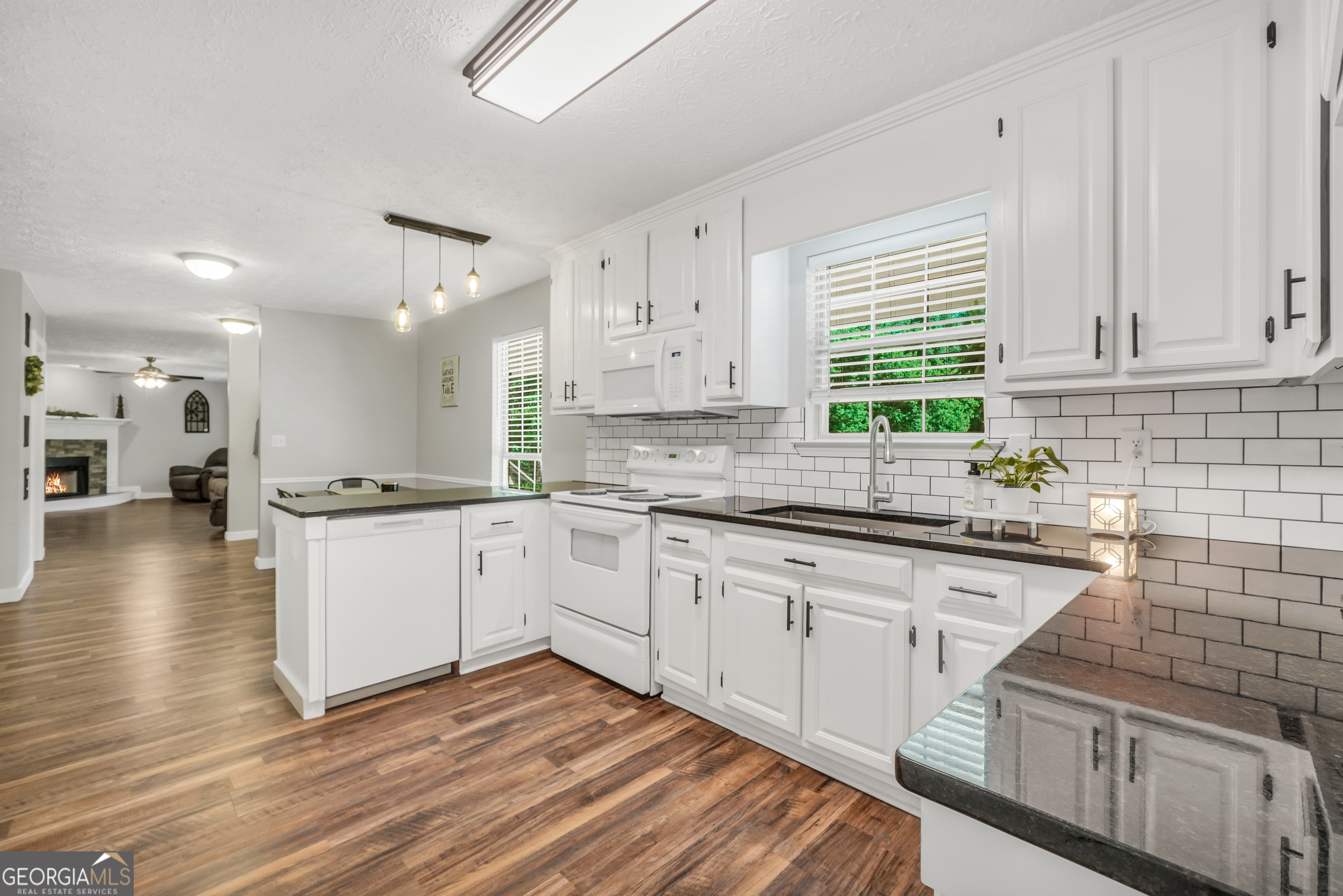 533 Chuli Road Griffin, GA 30223 - Photo 27 of 53 a kitchen with stainless steel appliances granite countertop a sink a stove and cabinets