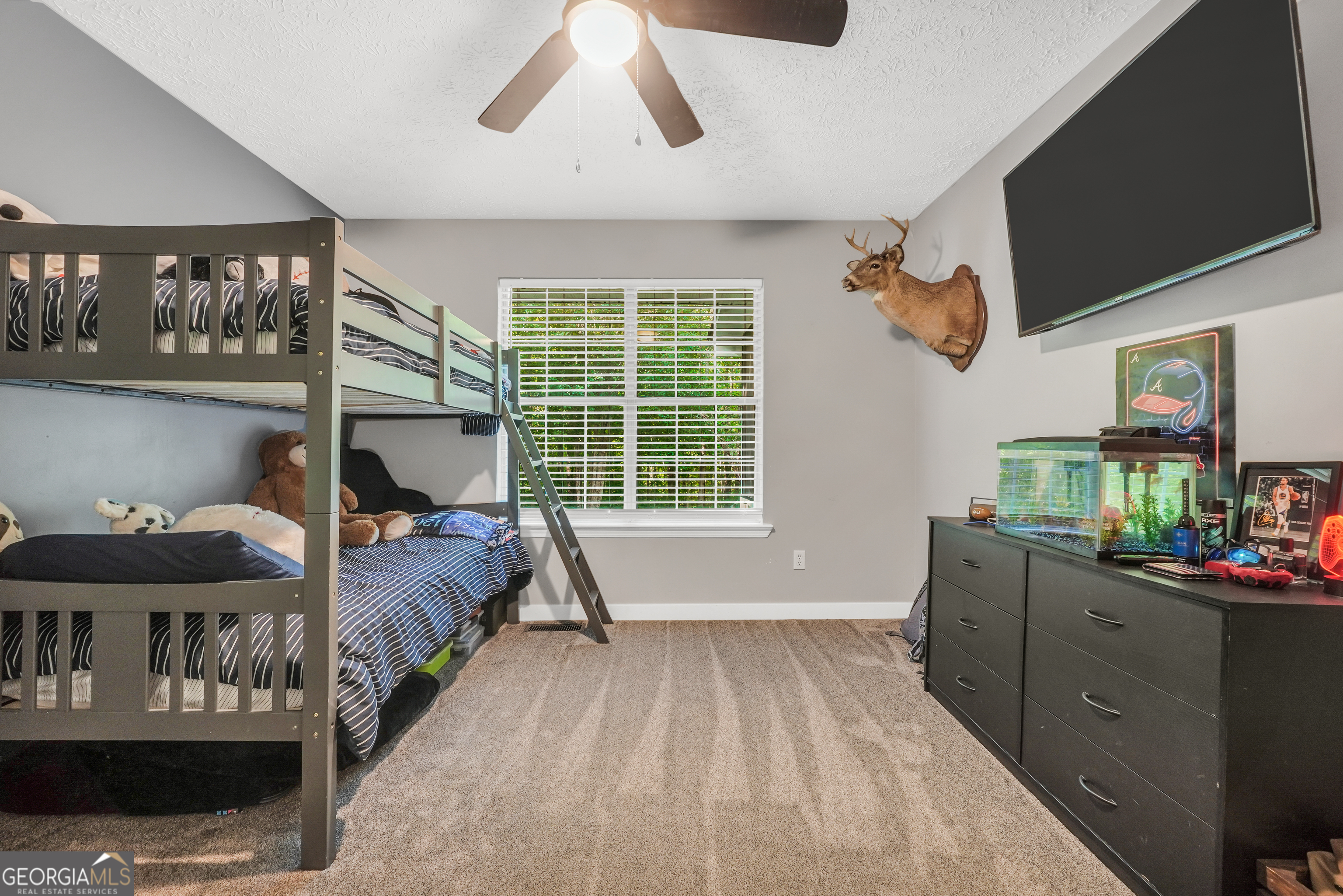 533 Chuli Road Griffin, GA 30223 - Photo 34 of 53 a bedroom with a bed and large window