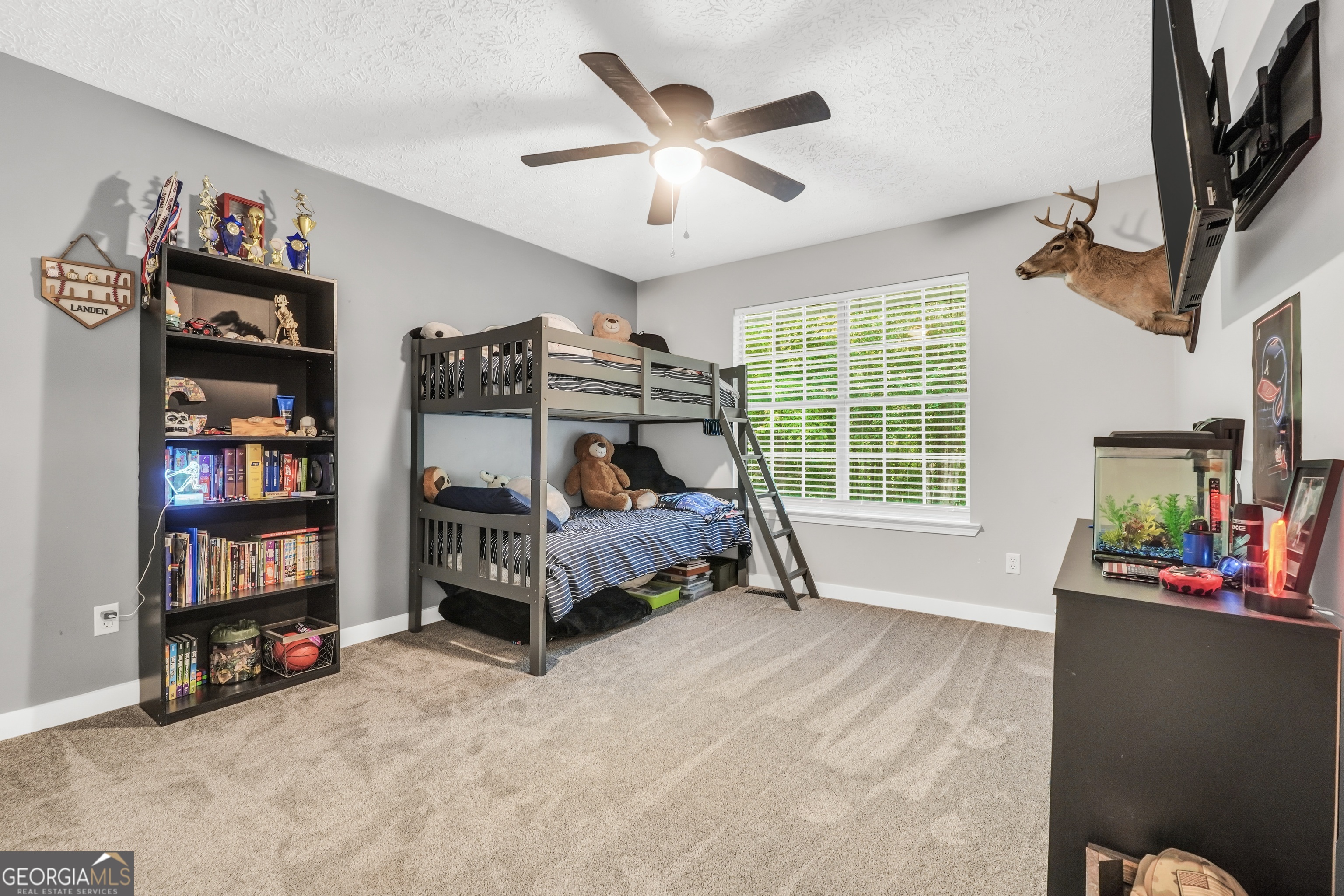 533 Chuli Road Griffin, GA 30223 - Photo 35 of 53 a bedroom with furniture and a large window