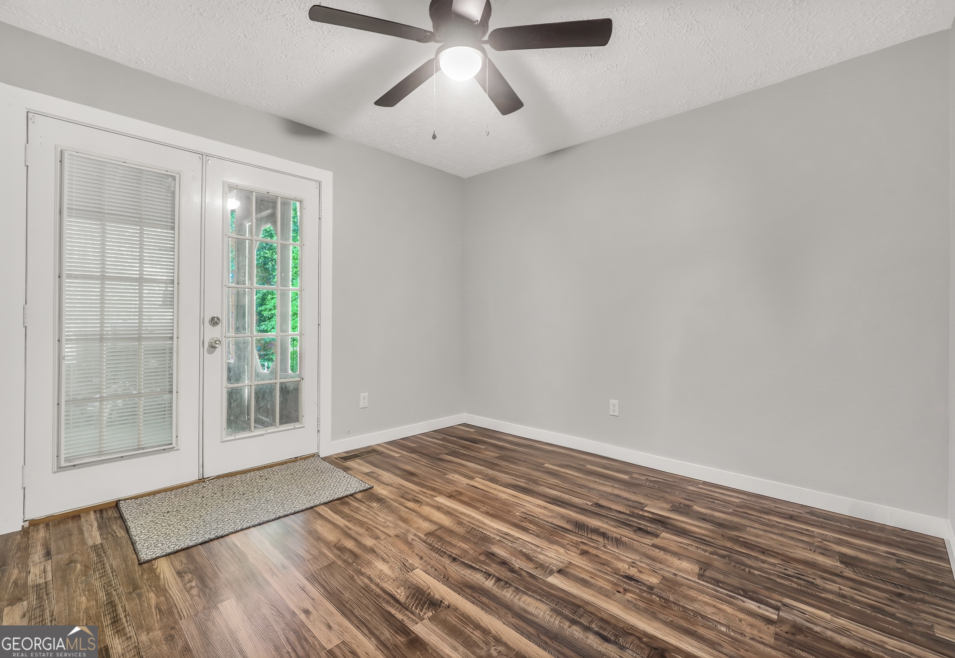 533 Chuli Road Griffin, GA 30223 - Photo 40 of 53 a view of an empty room with wooden floor and a window