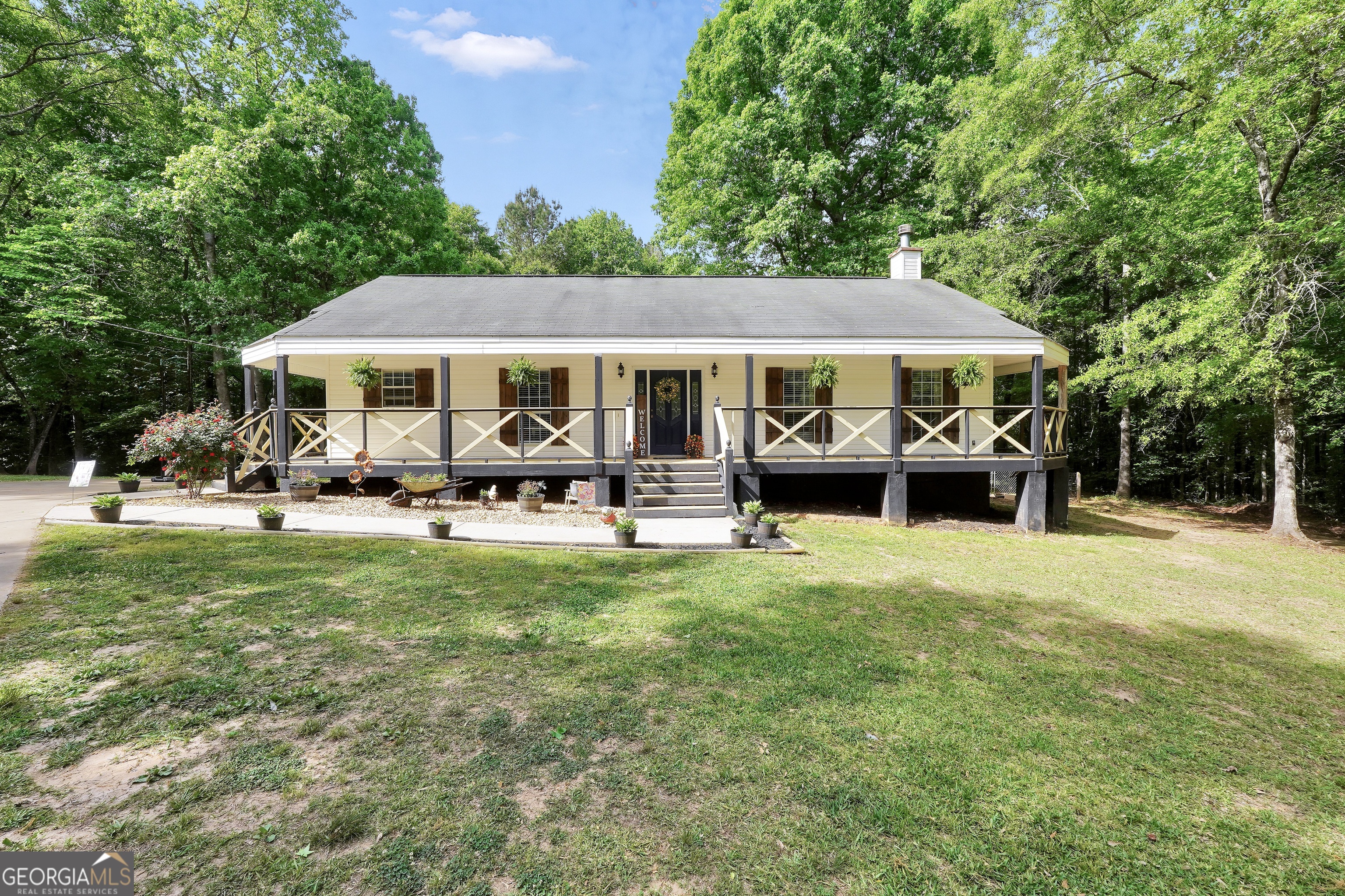 533 Chuli Road Griffin, GA 30223 - Photo 48 of 53 a front view of a house with a garden and trees