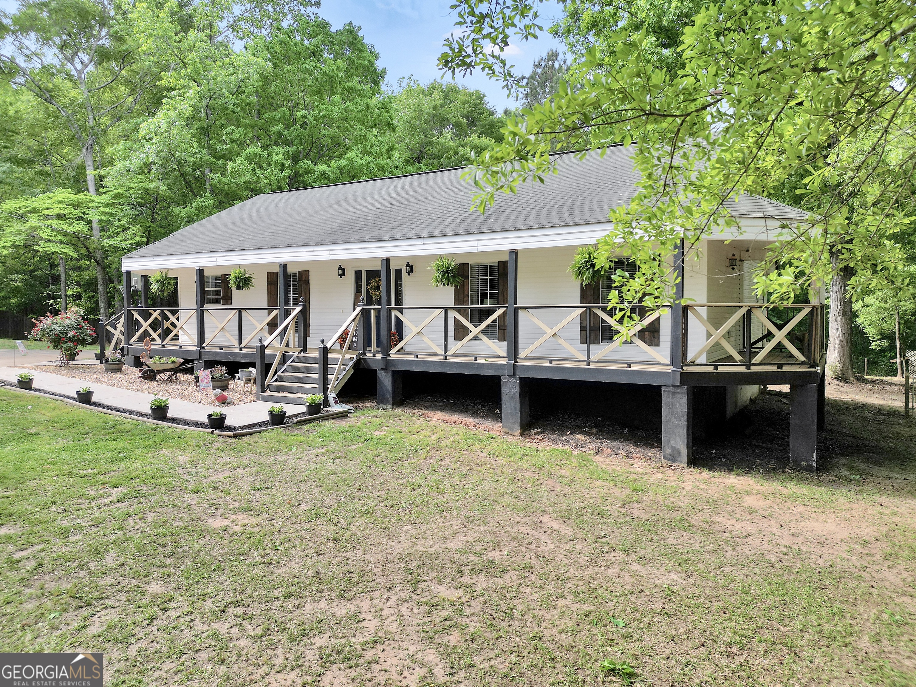 533 Chuli Road Griffin, GA 30223 - Photo 49 of 53 a view of a house with backyard porch and sitting area