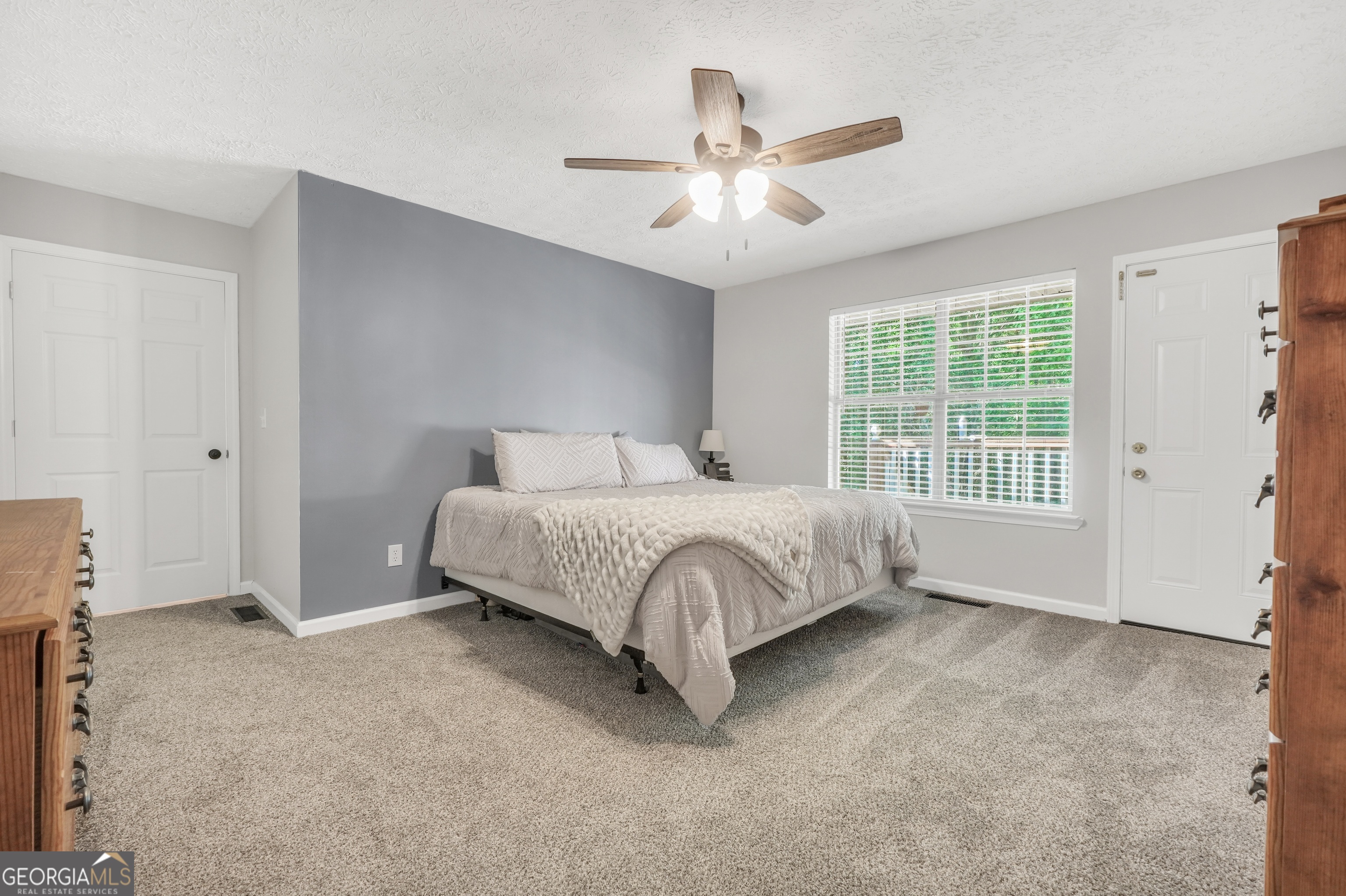 533 Chuli Road Griffin, GA 30223 - Photo 10 of 53 a large bed sitting in a room next to a window