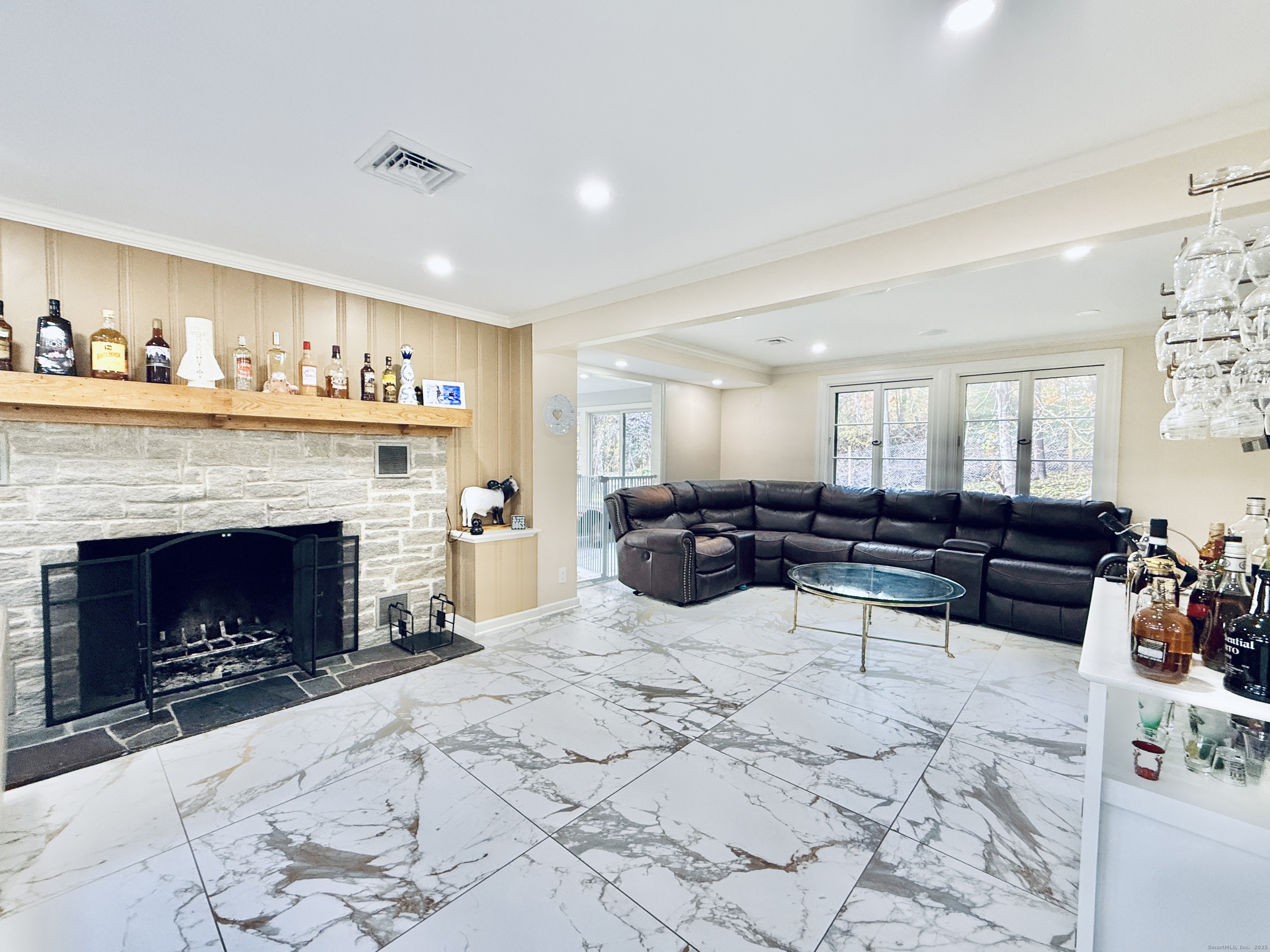 148 Bungay Road Seymour, CT 06483 - Photo 7 of 20 a living room with furniture a fireplace and window