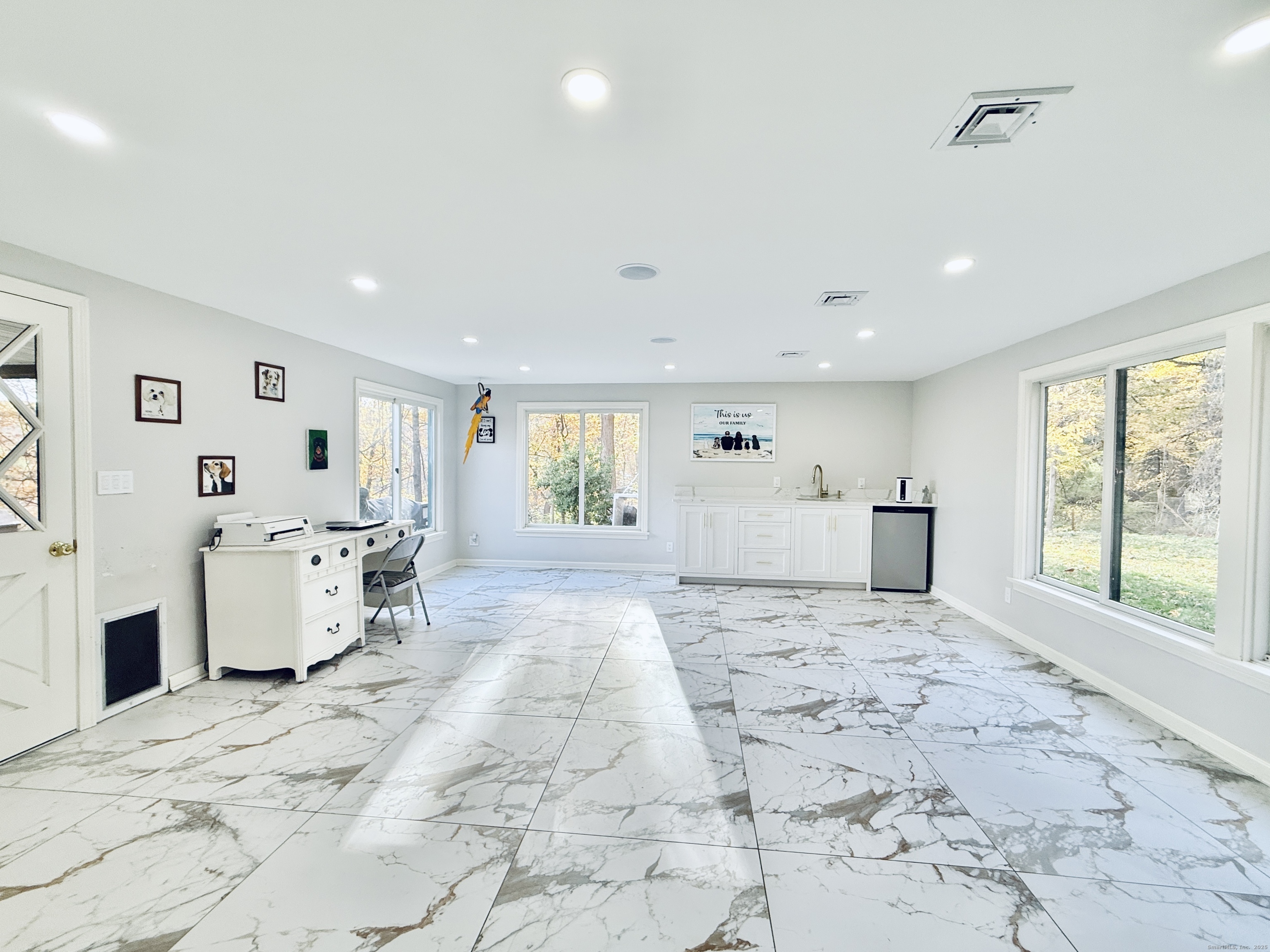 148 Bungay Road Seymour, CT 06483 - Photo 8 of 20 a large white room with a large window and chandelier