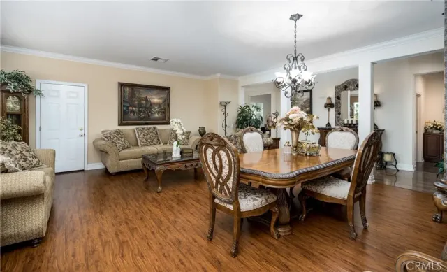 a bedroom with furniture and a potted plant