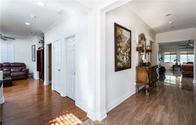 a bedroom with bed and wooden floor