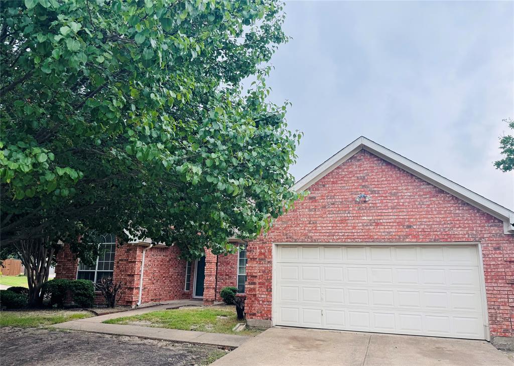 6501 Violet Drive Rowlett, TX 75089 - Photo 1 of 1 a front view of a house with garden