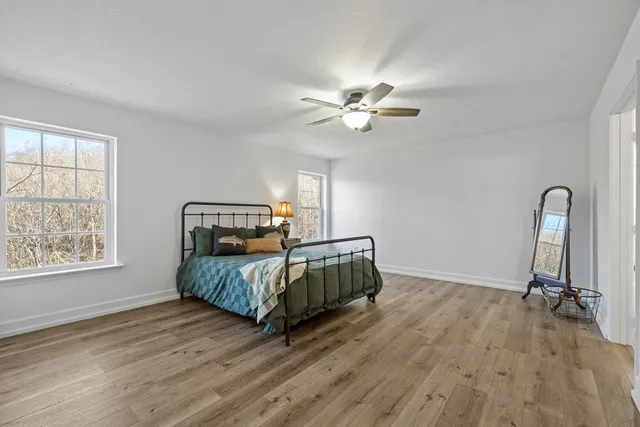 a bedroom with a bed and window