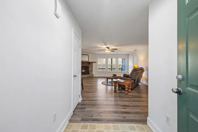 a view of a entryway with furniture and floor to ceiling window