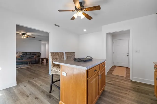 a kitchen with a stove and a refrigerator