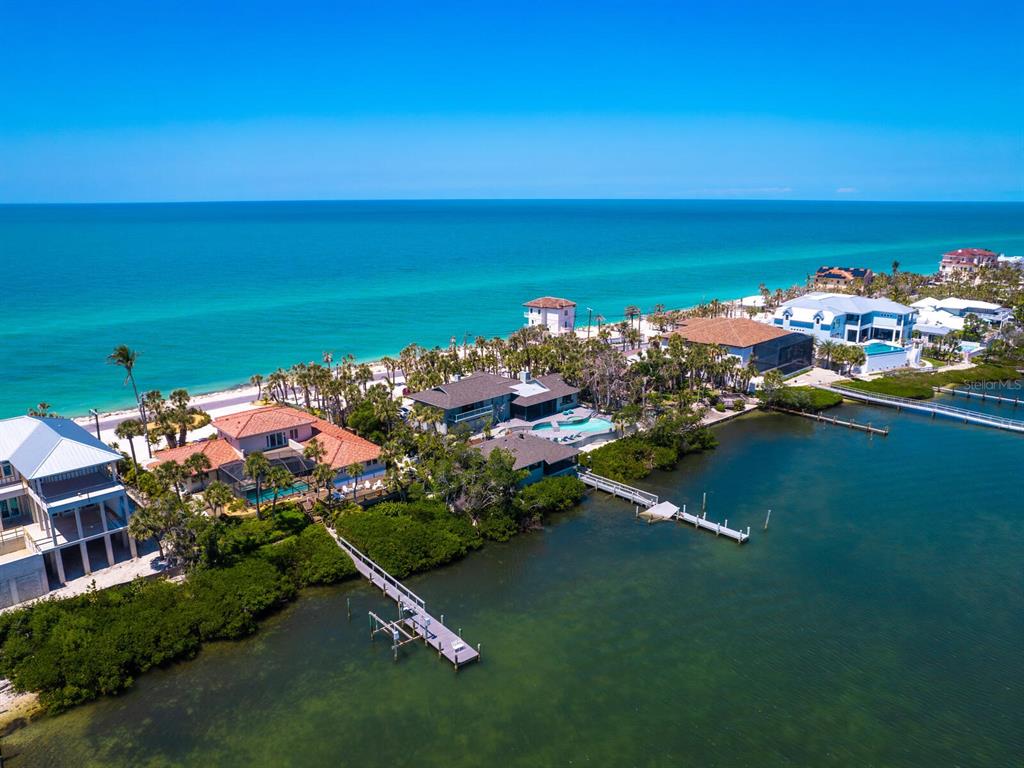 an aerial view of a house with a ocean view