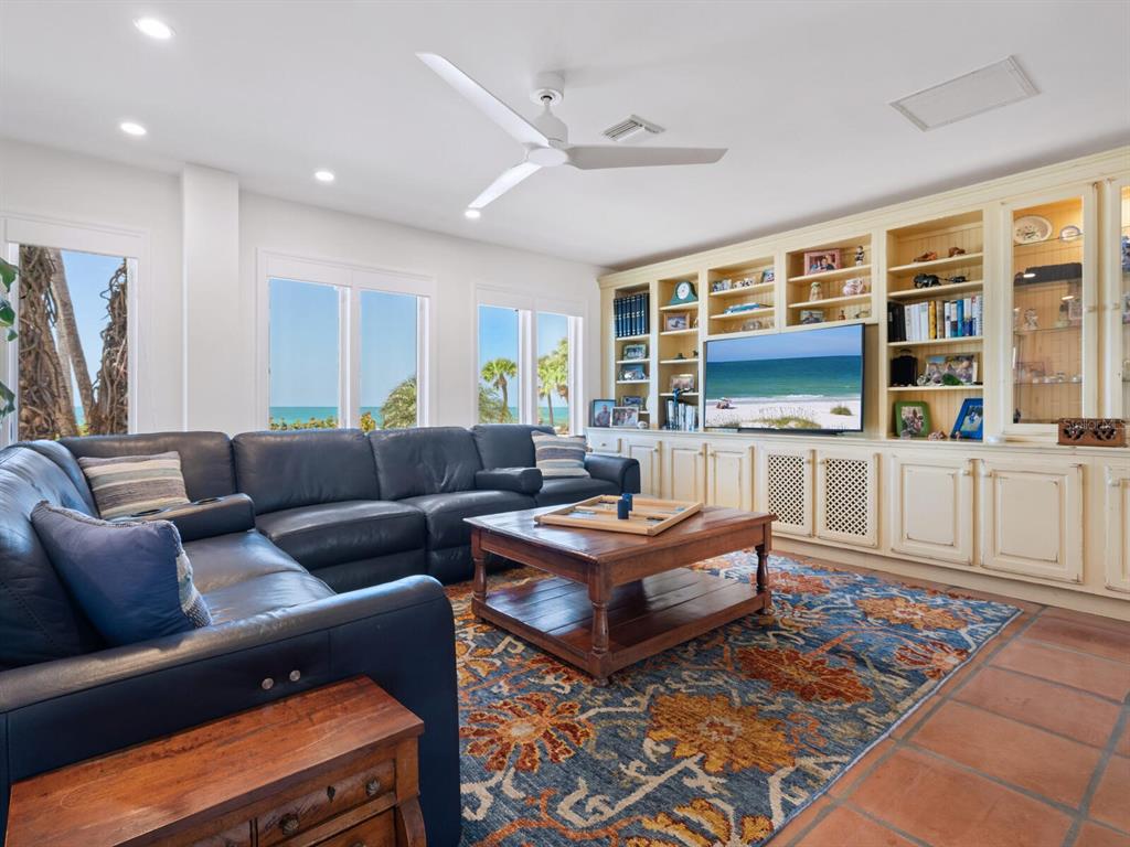 3300 Casey Key Road Nokomis, FL 34275 - Photo 16 of 65 a living room with furniture and a flat screen tv