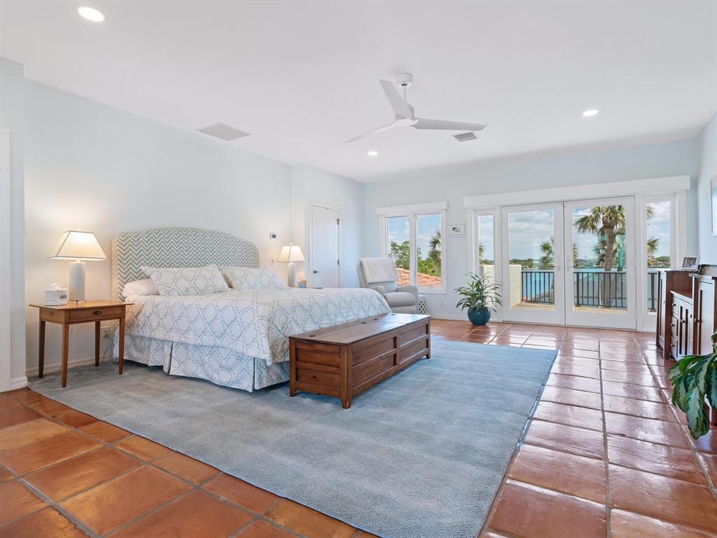 3300 Casey Key Road Nokomis, FL 34275 - Photo 19 of 65 a spacious bedroom with a large bed and a rug