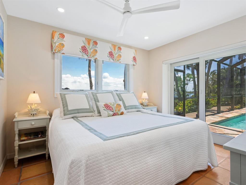 3300 Casey Key Road Nokomis, FL 34275 - Photo 27 of 65 a bedroom with a large bed and a window