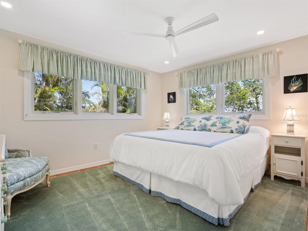 3300 Casey Key Road Nokomis, FL 34275 - Photo 29 of 65 a bedroom with furniture and a large window