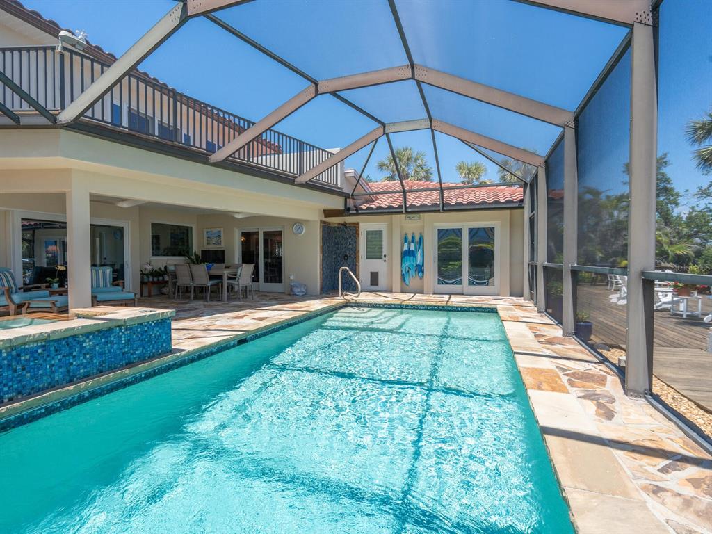 3300 Casey Key Road Nokomis, FL 34275 - Photo 34 of 65 a view of a house with sitting area and swimming pool