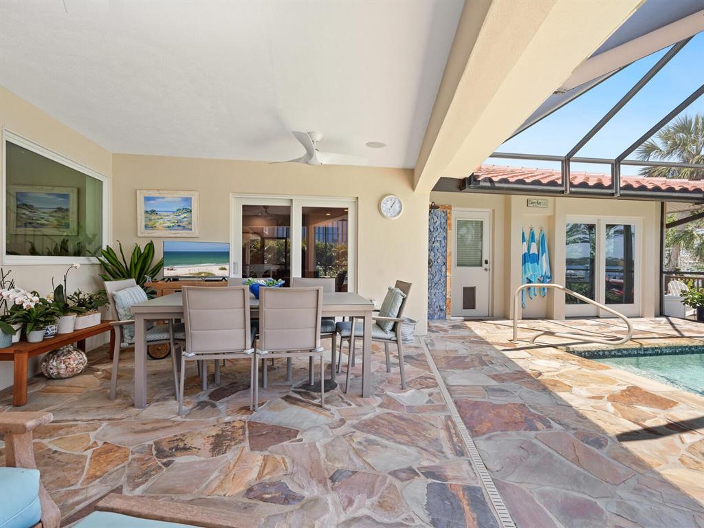 3300 Casey Key Road Nokomis, FL 34275 - Photo 35 of 65 a view of a dining room with furniture