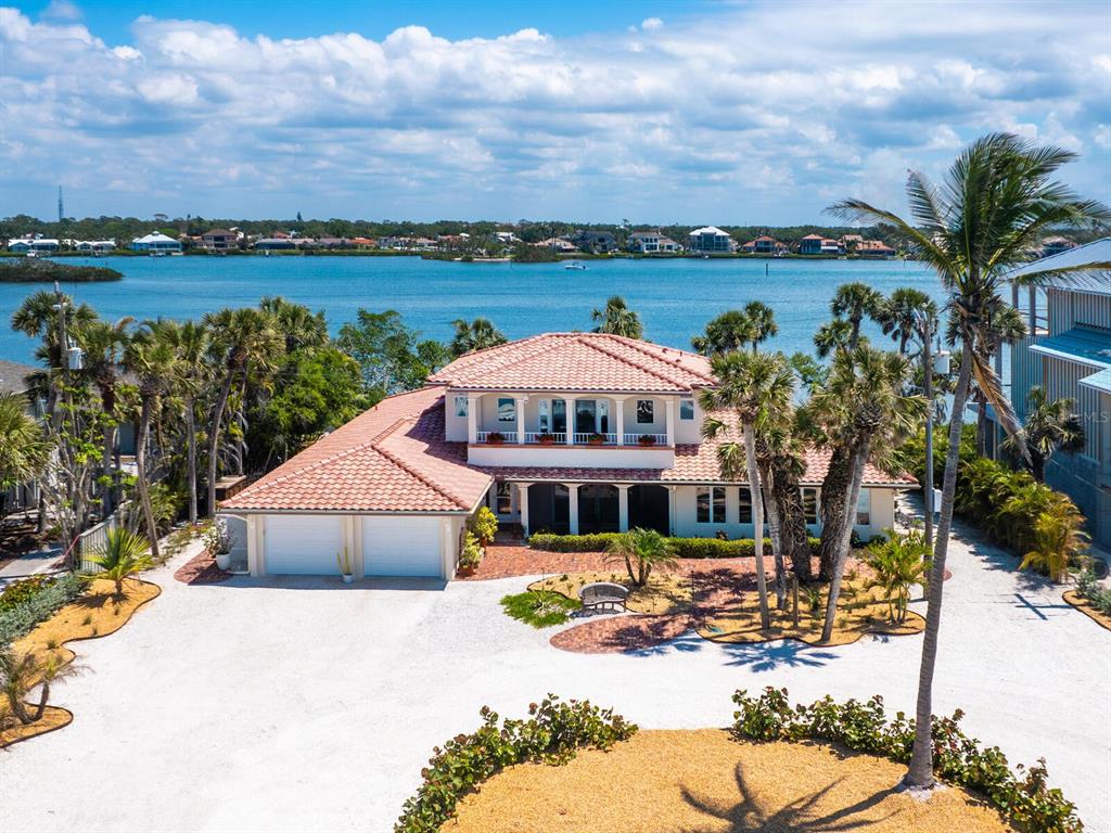 3300 Casey Key Road Nokomis, FL 34275 - Photo 4 of 65 a front view of a house with a yard