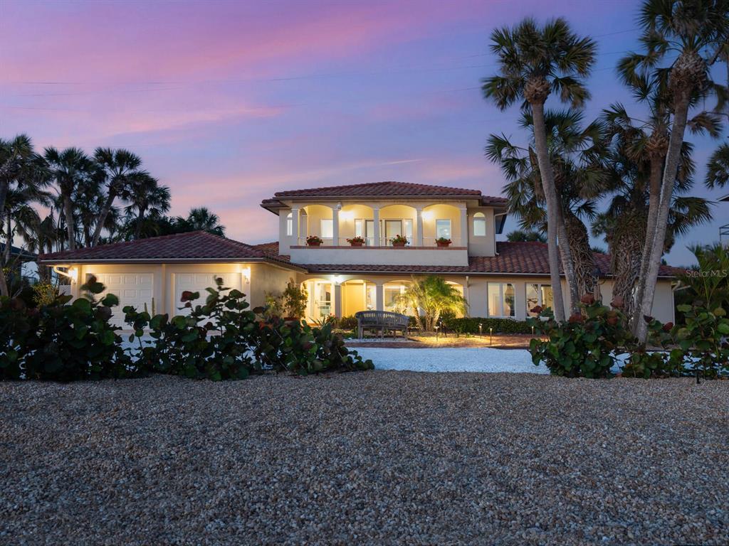 3300 Casey Key Road Nokomis, FL 34275 - Photo 46 of 65 a view of a house with a yard and a street