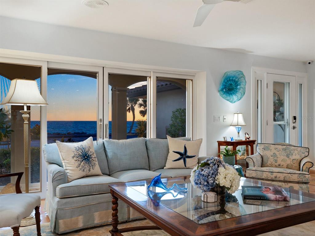 3300 Casey Key Road Nokomis, FL 34275 - Photo 49 of 65 a living room with furniture and a wooden floor