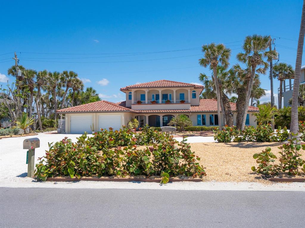 3300 Casey Key Road Nokomis, FL 34275 - Photo 62 of 65 front view of a house with a yard