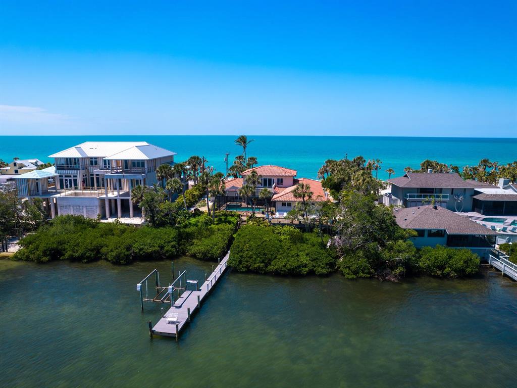 3300 Casey Key Road Nokomis, FL 34275 - Photo 64 of 65 an aerial view of a house with a garden and lake view