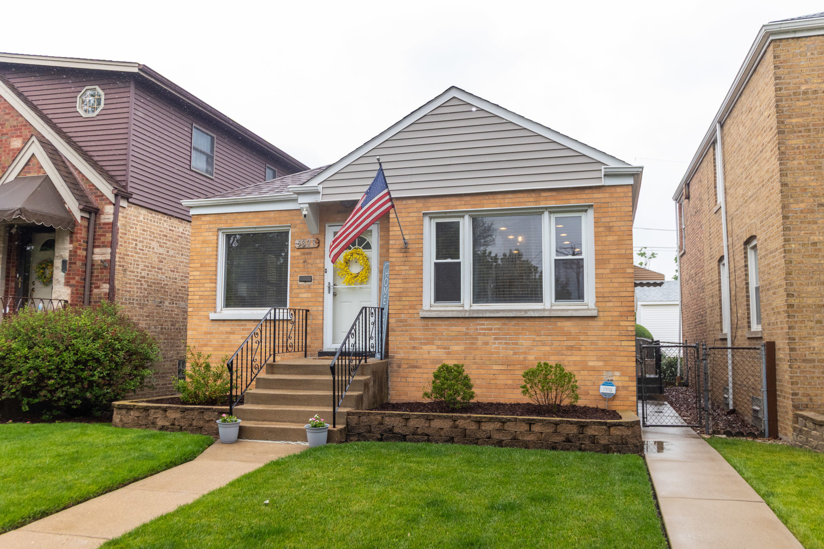 a front view of a house with a yard