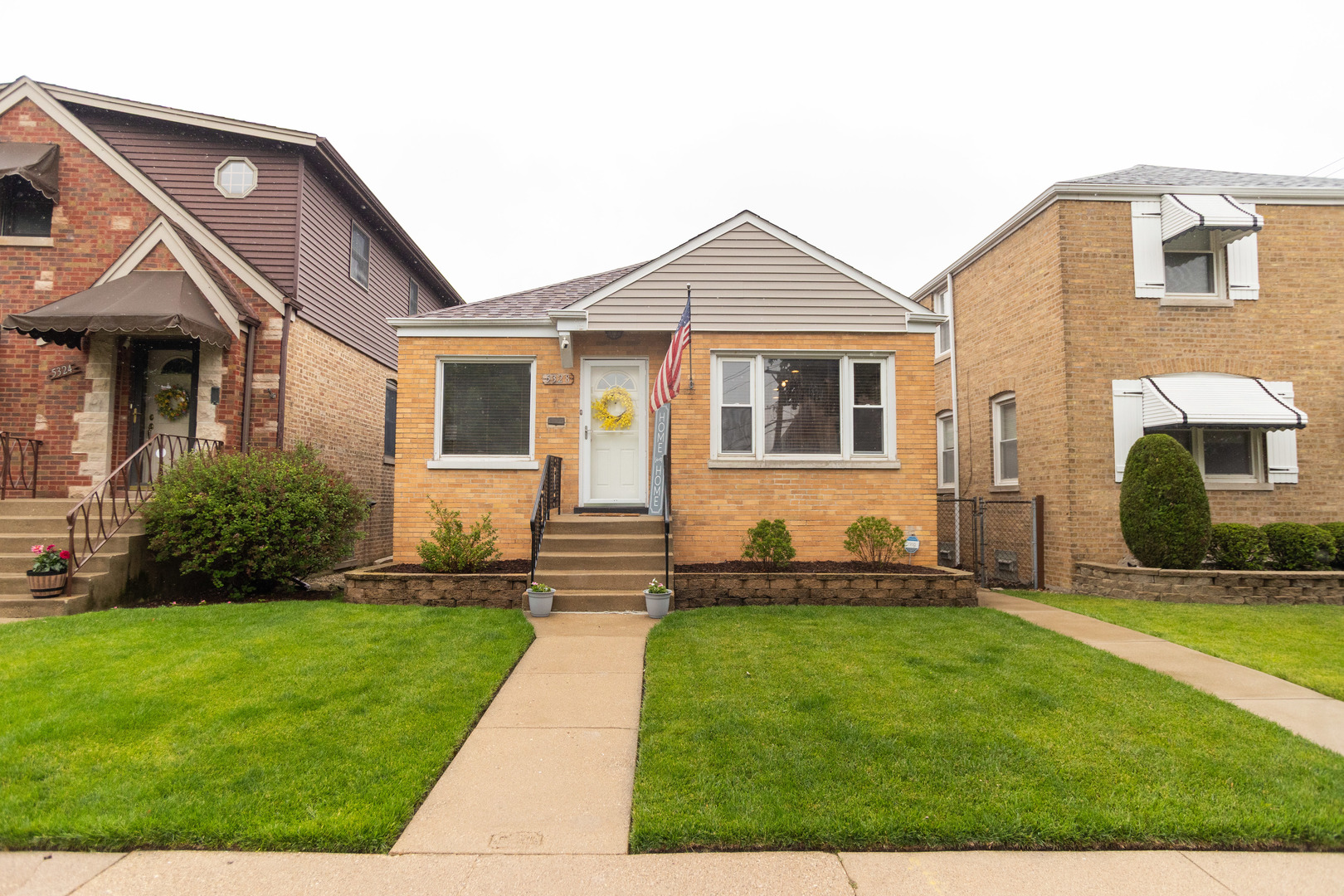 5328 North Rutherford Avenue Chicago, IL 60656 - Photo 2 of 40 a front view of a house with a yard