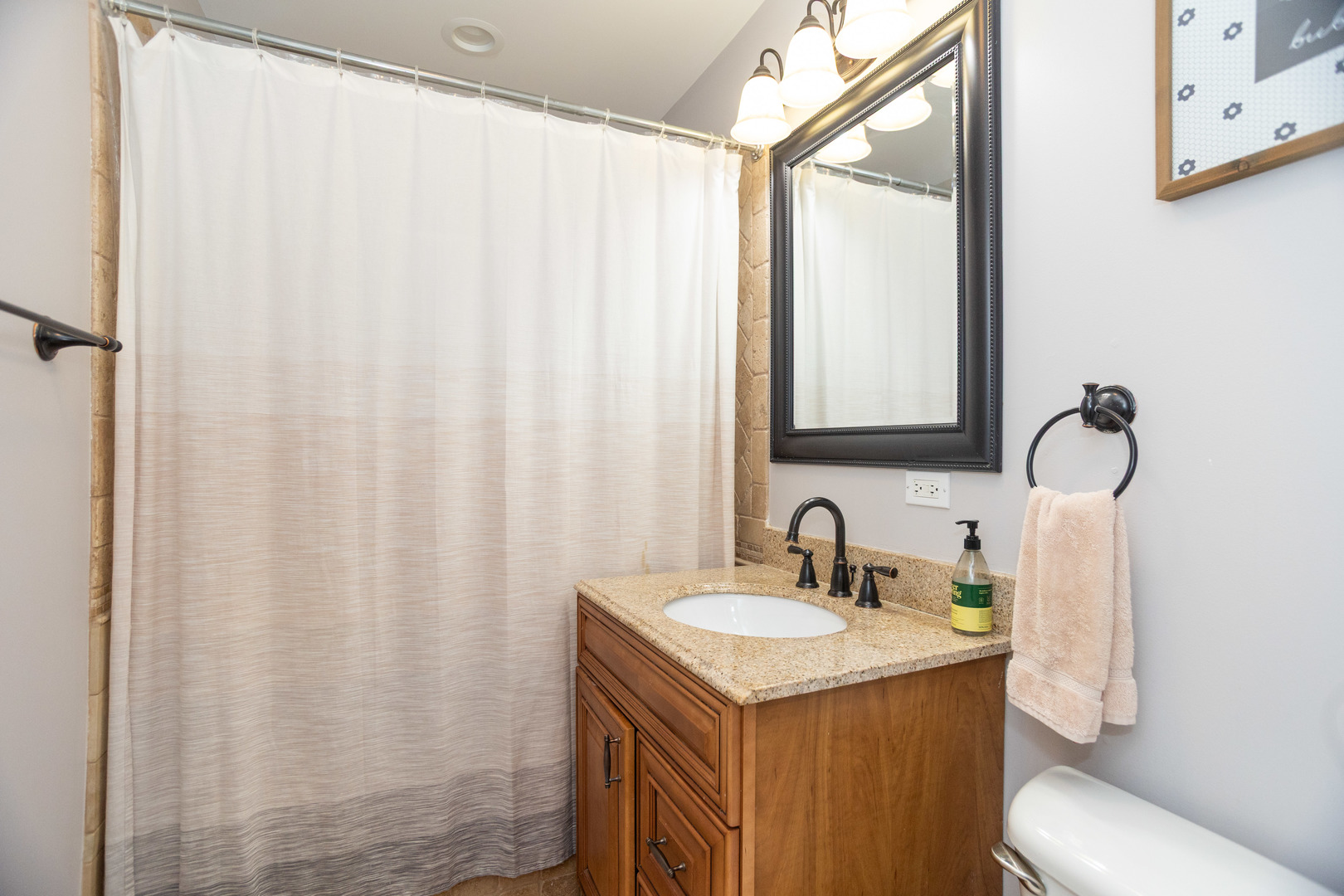 5328 North Rutherford Avenue Chicago, IL 60656 - Photo 9 of 40 a bathroom with a sink and a mirror