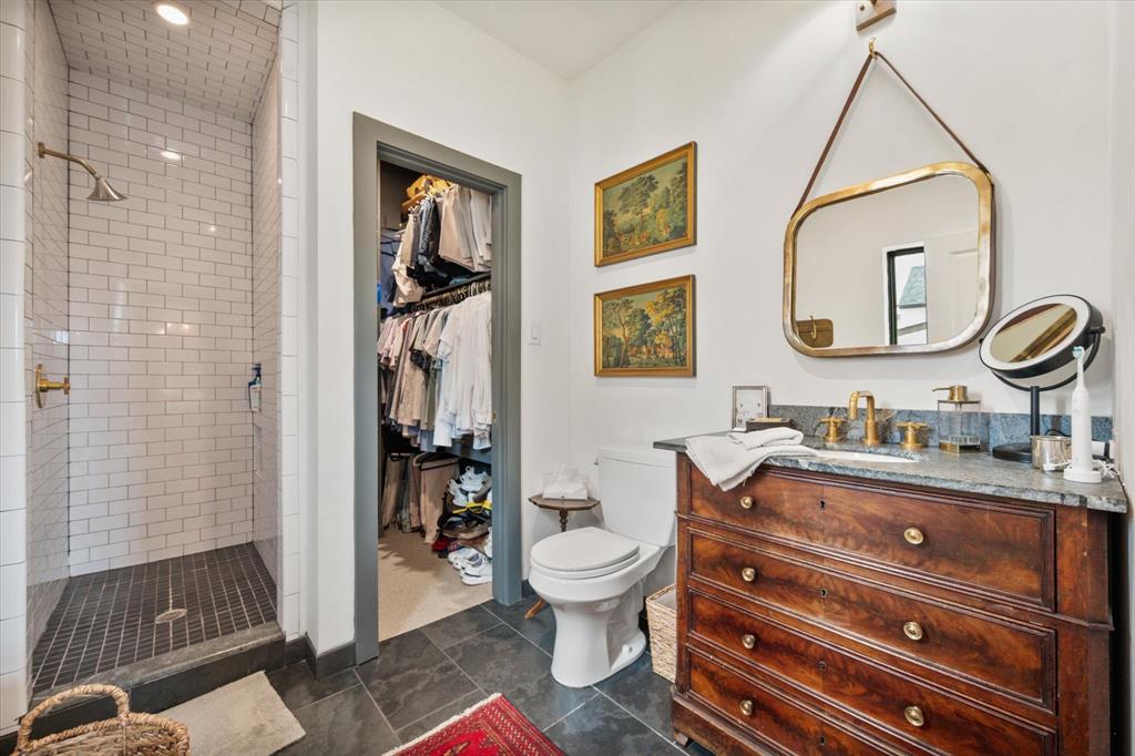 3824 Bishops Flower Road Fort Worth, TX 76109 - Photo 29 of 38 a bathroom with a toilet a sink and mirror