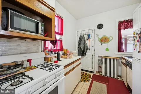 a kitchen that has a stove and a microwave