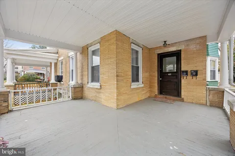 a view of a livingroom with furniture and staircase