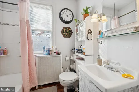 a bathroom with a toilet and a sink