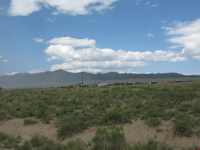 a view of a city with lush green forest