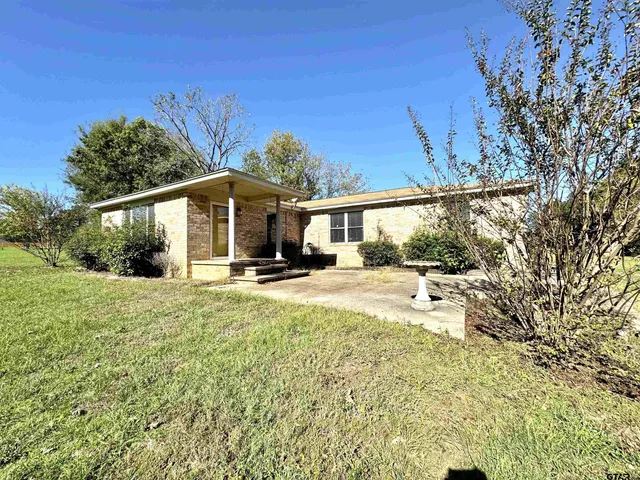 a house with trees in front of it